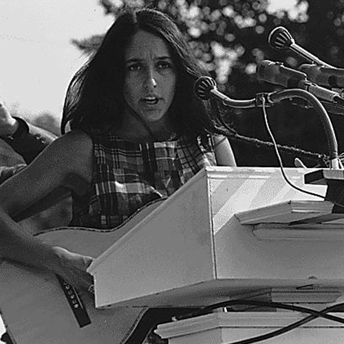 Civil Rights March on Washington, D.C. [Entertainment: Vocalist Joan Baez. A sign hanging near the microphones reads “We Shall Overcome.”], 08/28/1963